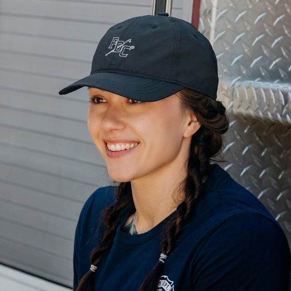 A 3/4 view of the Black FDC Pike Pole Dad Hat, made from black nylon and features a sleek white outline stitching of our iconic FDC Pike Pole logo.