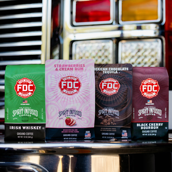 The Spirit Infused Coffee Bundle containing Irish Whiskey Infused Coffee, Black Cherry Bourbon Infused Coffee, Strawberries and Cream Rum Infused Coffee, and Mexican Chocolate Tequila Infused Coffee.